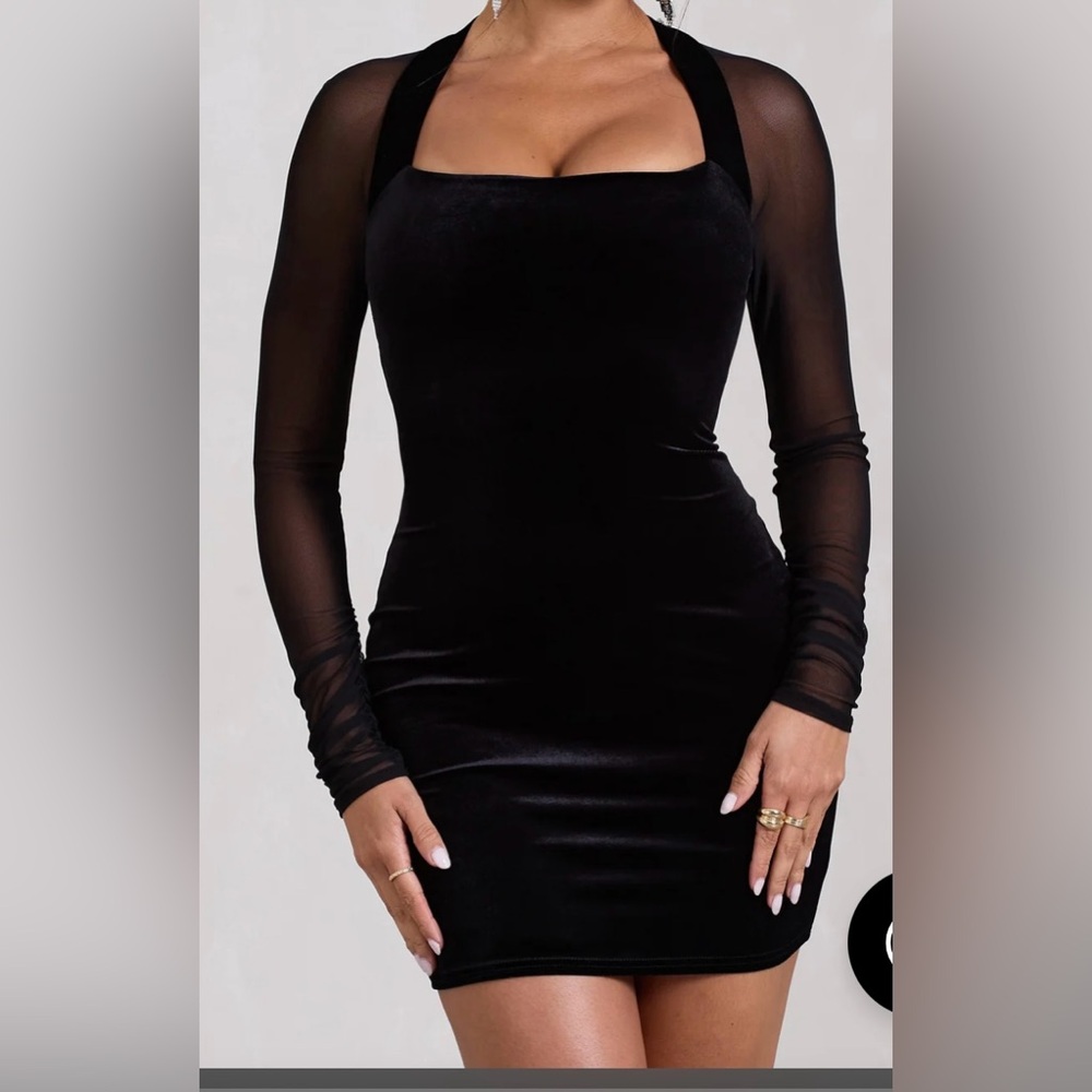 BLACK VELVET BODYCON MINI DRESS WITH SHEER SLEEVES AND GOLD CLAPSE ON BACK.